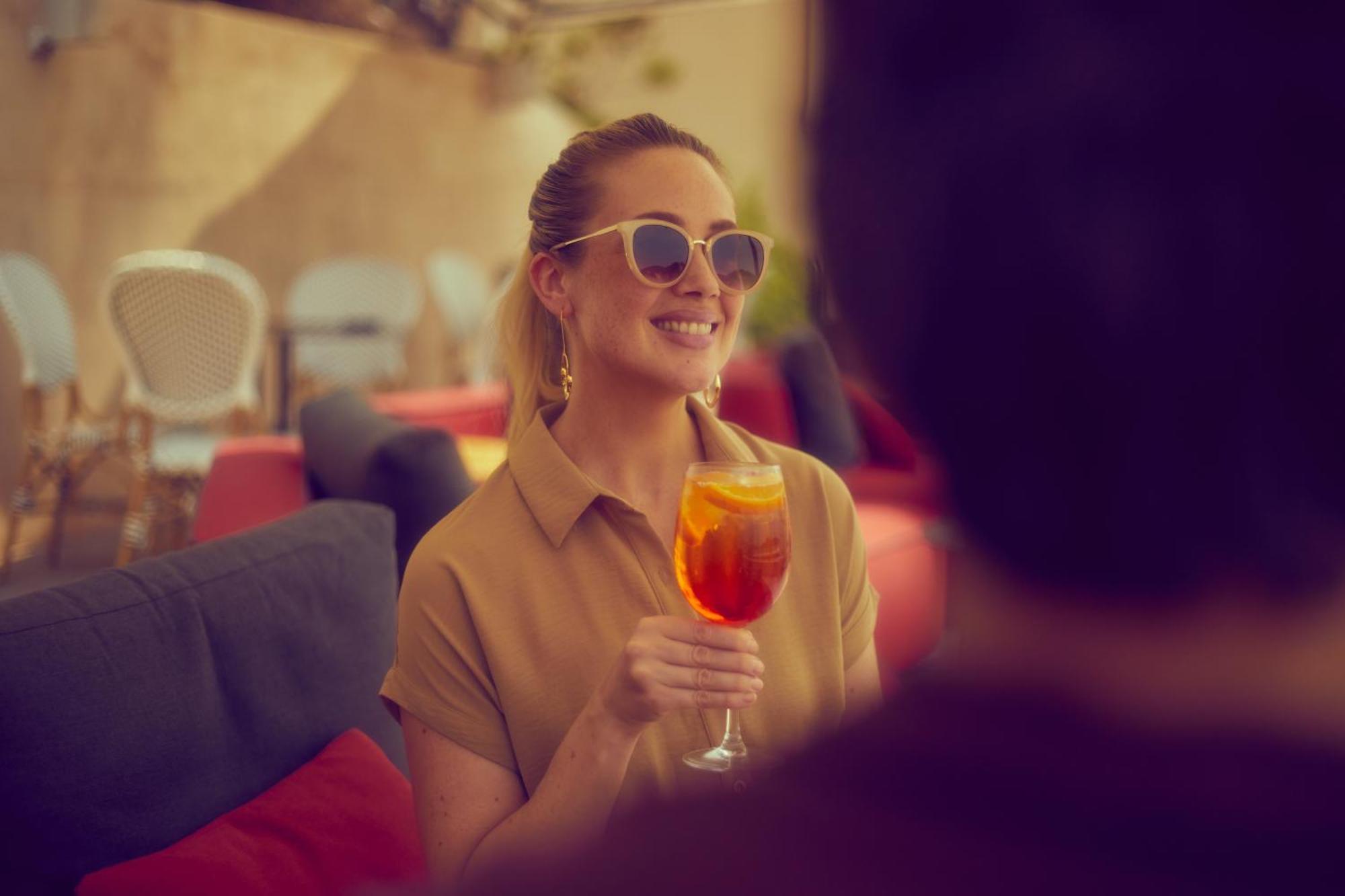 Secrets Mallorca Villamil Resort & Spa - Adults Only Παγκουέρα Εξωτερικό φωτογραφία A woman drinking an Aperol Spritz